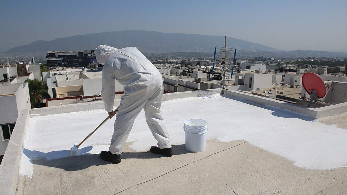 Roof surface being painted for thermal insulation